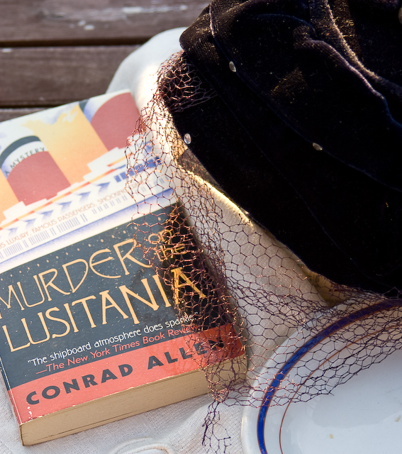 mystery novel and ladies hat