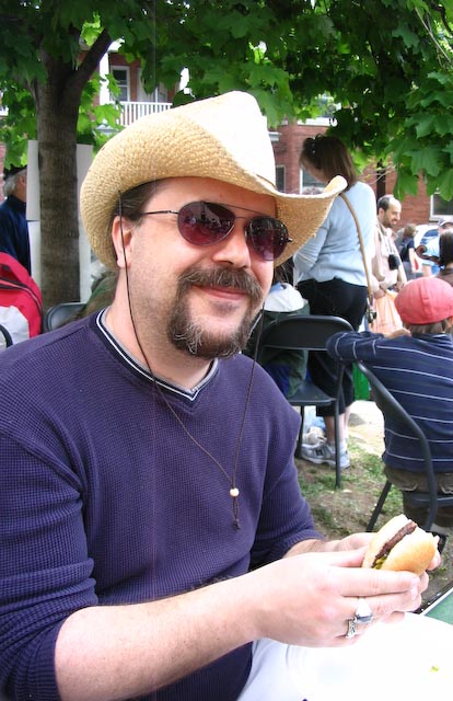 My husband Virgil eating a hot dog at the Great Glebe Garage Sale